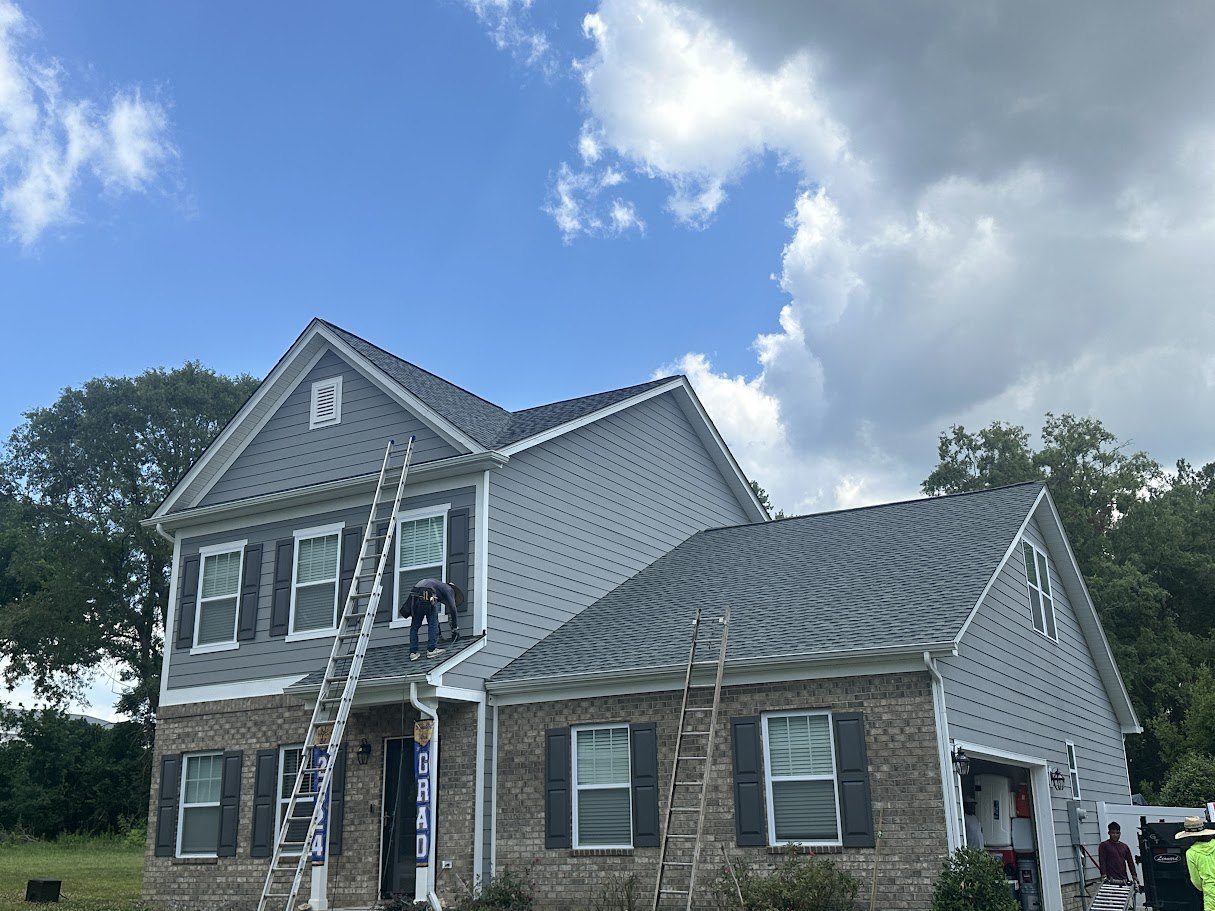 Same home with new charcoal architectural shingles going on, D2R crew on the roof